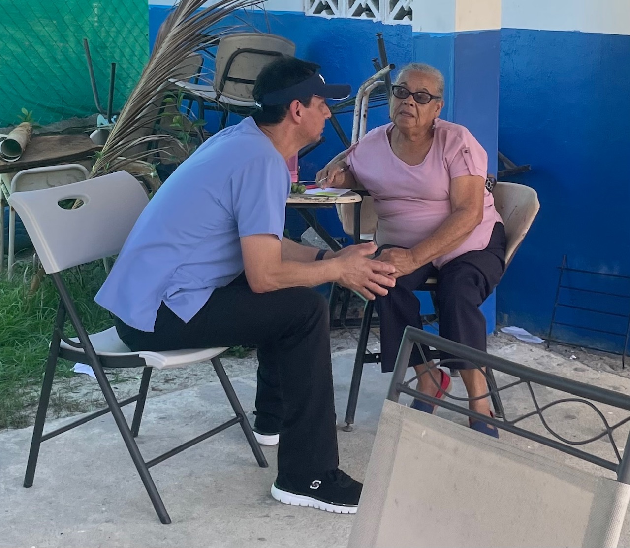 Caregiver speaking with senior resident